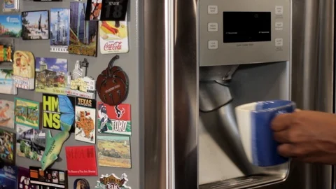 Filling Up Mug with Water from a Refrigerator.  Stock Footage 91017342