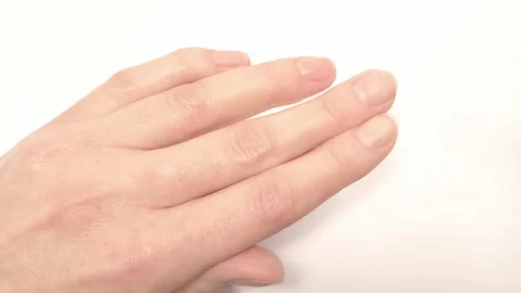 Filling nails shape with a metal nail file Stock Footage 256973164
