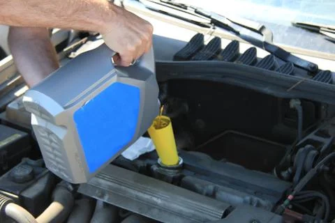 Filling oil of car engine Stock Photos