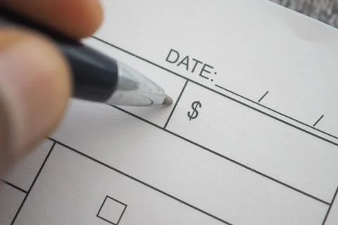 Filling out a form to record a payment in a simple process Stock Photos