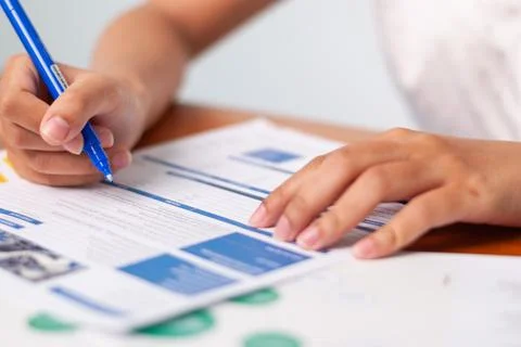 Filling out important forms office space document preparation professional .. Stock Photos