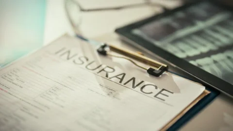 Filling out an insurance form a professional explains dental treatment cover Stock Footage 334075454