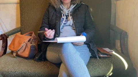 Filling Out Paperwork in Doctors Office Lobby Stock Footage 233852709