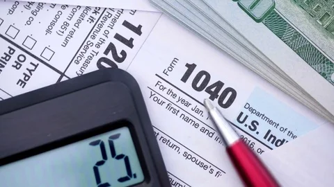 Filling out tax forms. High angle view. Stock Footage 82422006