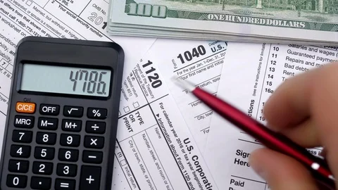 Filling out tax forms. High angle view. Stock-Footage 121072423