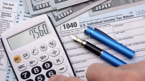 Filling out tax forms. High angle view. Stock Footage 121078271