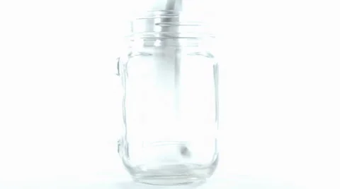 Filling penny in jar Stock Footage 60365270