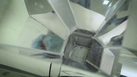 Filling the pharmaceutical dust collecting machine with green capsule pills Stock Footage 102459575