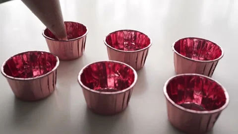 Filling the pink cupcakes cups using cooking bag Stock Footage 150673608