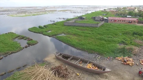 Filling pirogue with jerrycans Stock Footage 87028303
