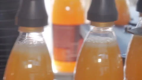 Filling of plastic bottles with products Stock Footage 98824257