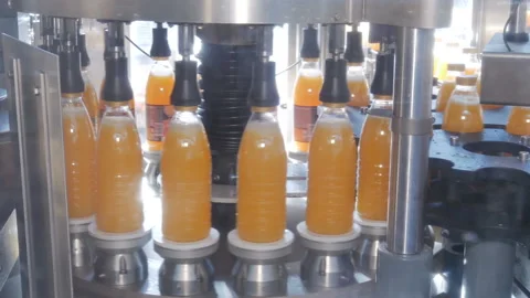Filling of plastic bottles with products Stock Footage 98825249