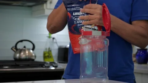 Filling plastic container with roast coffee. 스톡 동영상 158067918