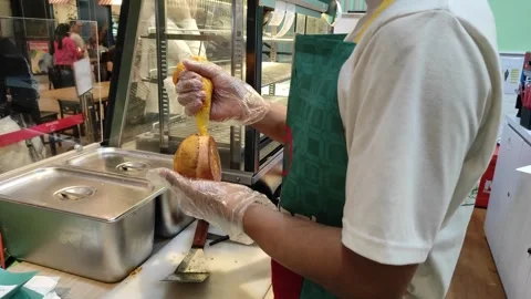 The filling process of salted egg sauce into the bun Stock Footage 264157058