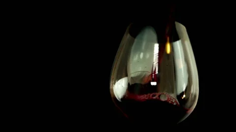 Filling red wine glasses Stock Footage 62468517