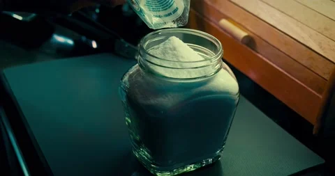 Filling the shiny jar Stockbeeldmateriaal 167431784