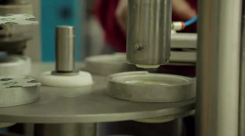 Filling small cups with fruit yogurt Stock Footage 36193541