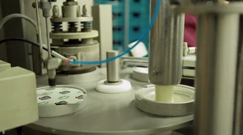 Filling small cups with fruit yogurt Stock-Footage 36193592