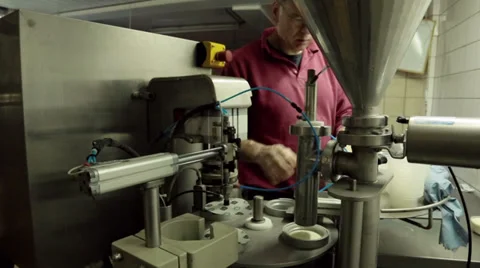 Filling small cups with fruit yogurt Stock Footage 36193845