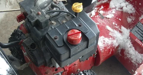Filling a Snowblower with Gas - Winter Stock Footage 101924439