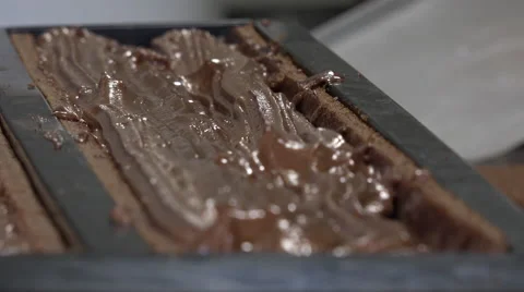 Filling the sponge cake with chocolate, pear jelly and praline Stock Footage 57922106
