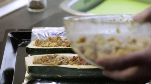 Filling squash boats Stock Footage 119781309