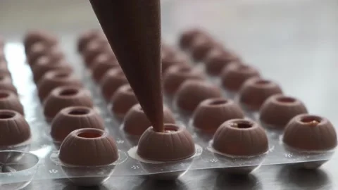 Filling up sweets. Stock Footage 132800305