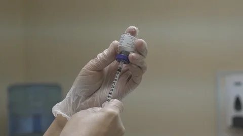 Filling the syringe from the ampoule Stock Footage 103088928