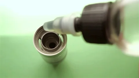 Filling of a tank for an electronic cigarette Stock Footage 71141865