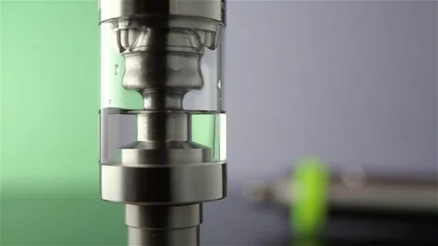 Filling of a tank for an electronic cigarette Stock Footage 71141979