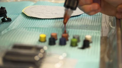 Filling Tattoo Ink Caps Stock Footage 96611685
