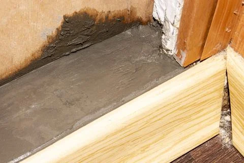 Filling the threshold with concrete.Cementing of the threshold. Stock Photos