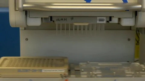 Filling tubes samples by a laboratory machine Stock Footage 73897998