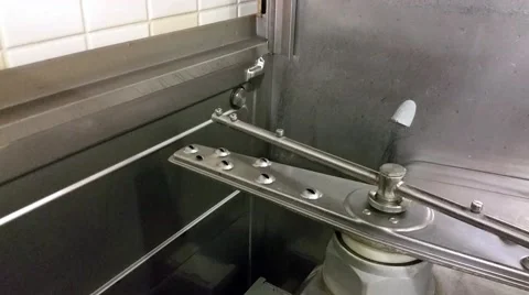Filling a turning on a restaurant kitchen dishwasher Stock Footage 58117751