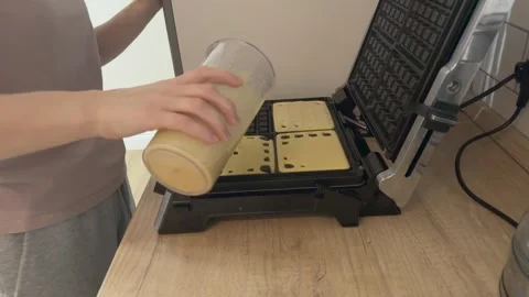 Filling Waffle Maker Cells With Batter Even Cooking Preparation Close Kitchen Video stock 336443388
