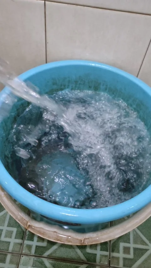 Filling water to Bucket Stock Footage 217885363