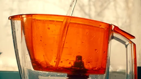 Filling the water filter for water purification Stock Footage 102477967