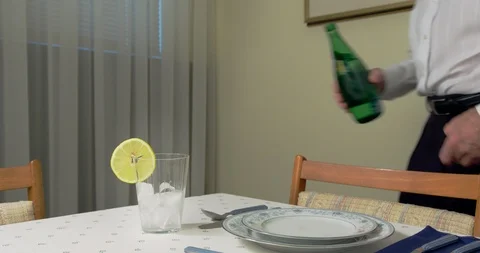 Filling Water Glass on Dining Table. Stock Footage 93665615