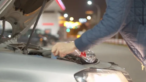 Filling windshield washer fluid Stock Footage 128829036