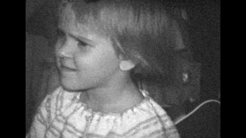 Film archive, adorable little girl portrait looking at camera, close up, waving Stock Footage 276430779