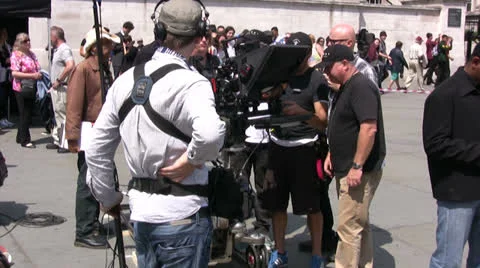 Film crew with cameraman preparing to film TV Broadcast on a film set Stock Footage 25039117