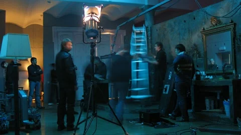 Film crew prepares decorations while making video clip Letet Stock Footage 1045710
