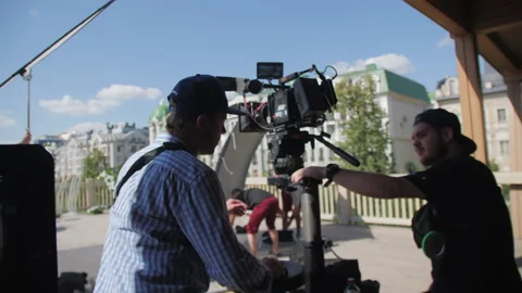 Film director watches video on camera monitor at set Stock Footage 231294604