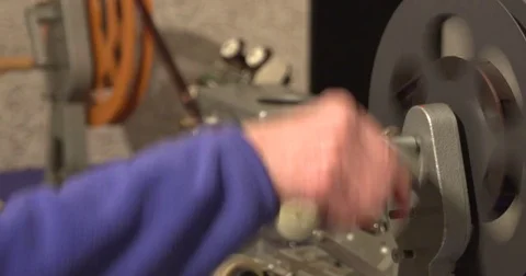 Film Editor at work, using a vertical film viewer - medium shot Stock Footage 75677105