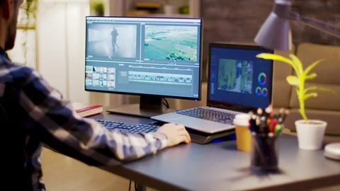 Film maker using modern software for post production Stock Footage 120557322