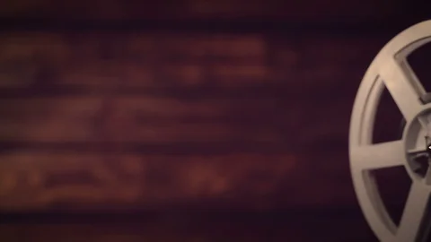 Film projector on a black background with dramatic lighting and selective focus. Stock Footage 95905760