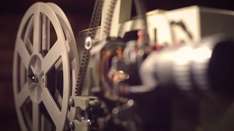 Film projector on a black background with dramatic lighting and selective focus. Stock Footage 97919966