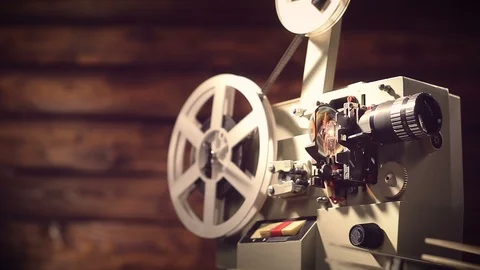 Film projector on a black background with dramatic lighting and selective focus. Stock Footage 100172806