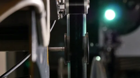 Film Projector Closeup with Projection Screen on the Back Stock Footage 80540451