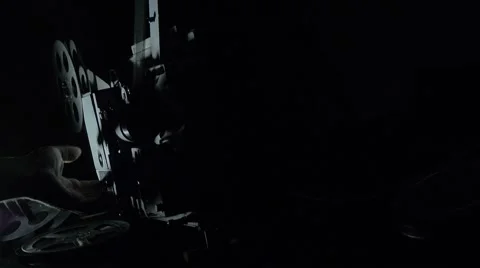 The film projector is started, dark background Stock Footage 68967866